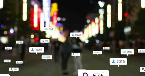 Blurred couple walking night city street with social media notifications and neon bokeh