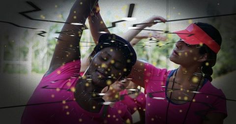 Women in Pink Performing Outdoor Stretching Exercises