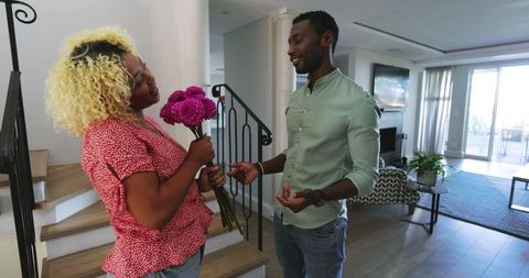 Joyful Friends Chatting in Modern Living Space with Cozy Ambience