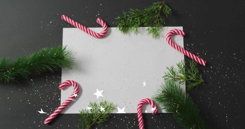 Festive Christmas Card Layout with Candy Canes and Evergreen Branches