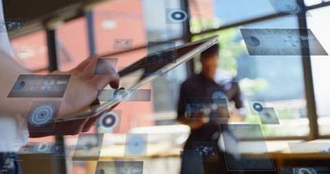 Swiping tablet controlling floating hud panels in sunlit office workspace for collaboration