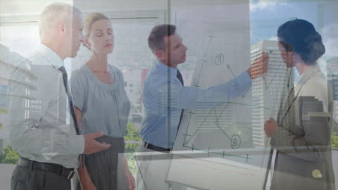 Business Team Analyzing Growth Strategy During Office Presentation