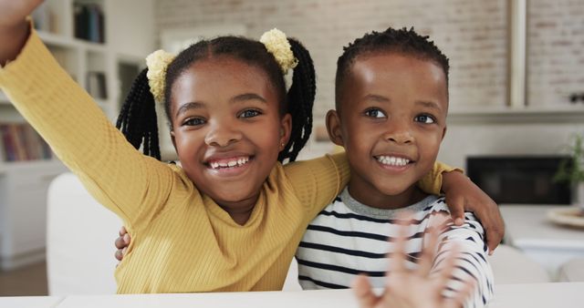 Happy African American Siblings Embracing and Smiling Indoors - Download Free Stock Images Pikwizard.com