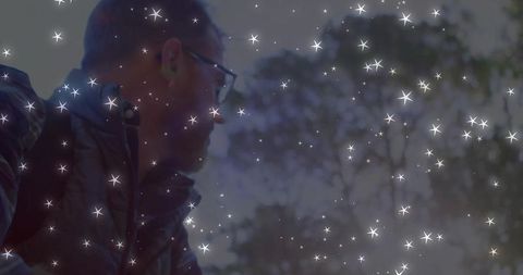 Man Outdoors in Forest Adventure Overlaid with Star Effect