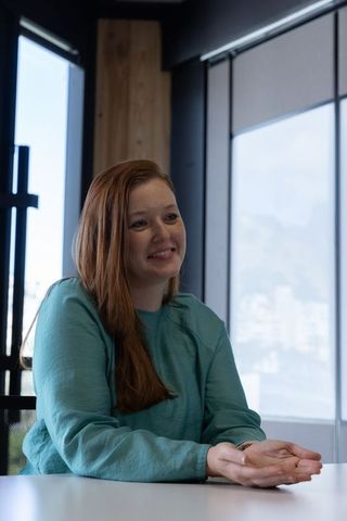 Confident Businesswoman Engaging in Team Meeting