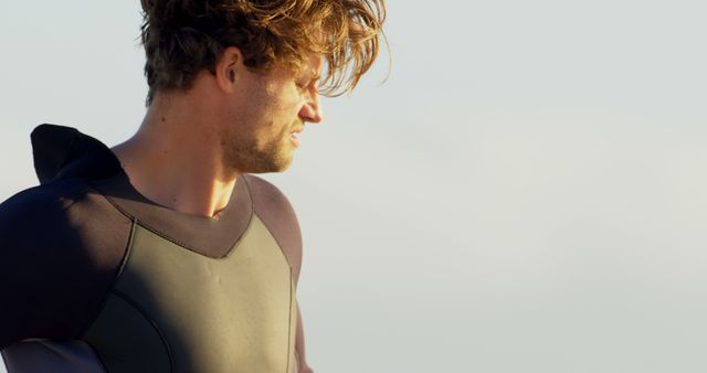 Surfer Preparing for Waves in Wetsuit at Dawn - Download Free Stock Images Pikwizard.com