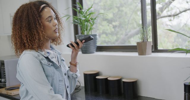 Biracial Woman Using Smartphone in Home Kitchen - Download Free Stock Images Pikwizard.com