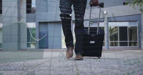 Businessman Walking with Suitcase and Financial Data Overlay