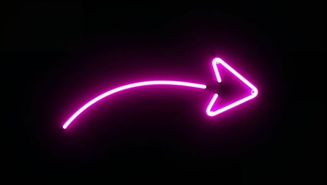 Glowing neon pink arrow with modern tubular illumination