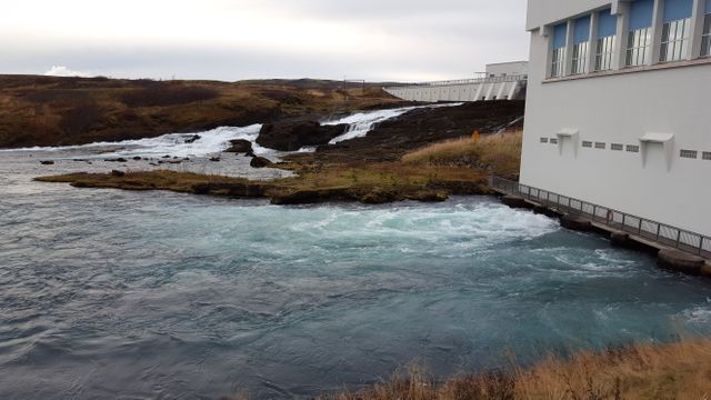 Hydroelectric Power Plant Near Rushing Water - Download Free Stock Images Pikwizard.com