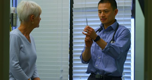 Doctor Preparing Vaccine for Senior Female Patient in Clinic - Download Free Stock Images Pikwizard.com