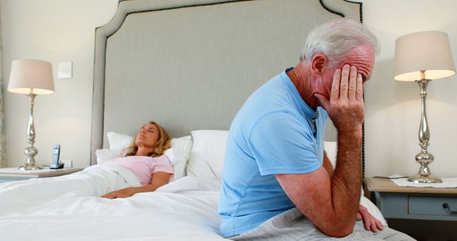 Senior Couple Arguing in Bedroom with Man Sitting Distressed on Bed - Download Free Stock Images Pikwizard.com