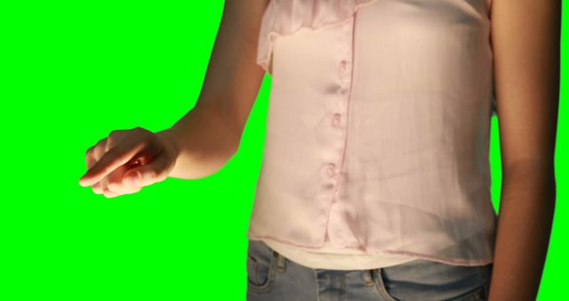 Woman in light blouse touching virtual screen isolated on green background - Download Free Stock Images Pikwizard.com