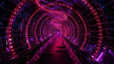 Futuristic neon tunnel with pink and purple lights