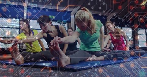 Women group stretching together in gym for fitness and relaxation