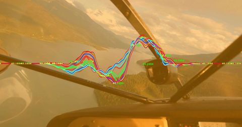 Flying over scenic lakes in cockpit displaying digital graph