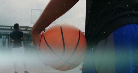 Close-Up of Player Holding Basketball on Urban Rooftop Court