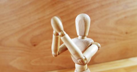 Wooden Artist Mannequin with Crossed Arms in Defensive Pose - Download Free Stock Images Pikwizard.com
