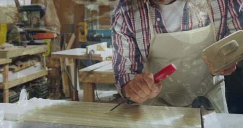 Carpenter Engaging in Precision Work Amid Digital Data Graphics