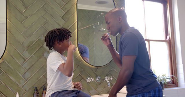 African American Father and Son Brushing Teeth in Modern Bathroom - Download Free Stock Images Pikwizard.com