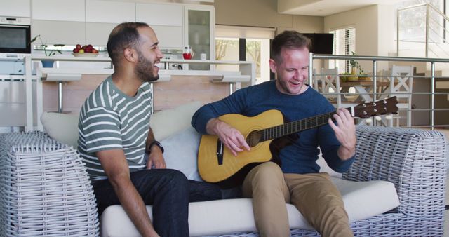 Happy Friends Playing Guitar and Smiling on Couch at Home - Download Free Stock Images Pikwizard.com