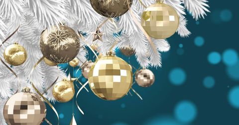 Elegant Gold and White Christmas Baubles on Christmas Tree Branch