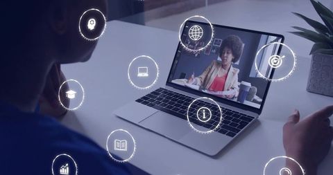 Watching remote learning session on laptop with virtual icons presenter taking notes