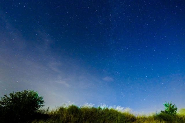 Clear Night Sky Stars over Grassy Hill - Download Free Stock Photos Pikwizard.com