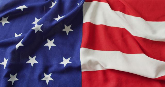 This image depicts a close-up of the American flag, highlighting the stars and stripes. It can be used in articles, websites, or social media posts related to American history, national holidays like Independence Day or Memorial Day, or patriotic events. It is suitable for educational materials about the United States and for promotional materials for businesses or organizations celebrating American culture.