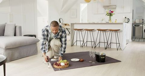Man celebrating anniversary candles modern home