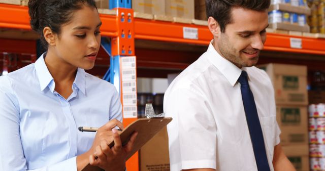 Coworkers Working Together in Modern Warehouse Environment - Download Free Stock Images Pikwizard.com