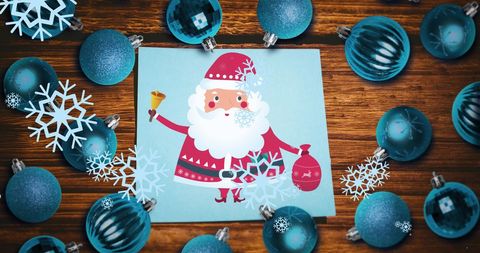 Festive santa illustration surrounded by blue christmas baubles
