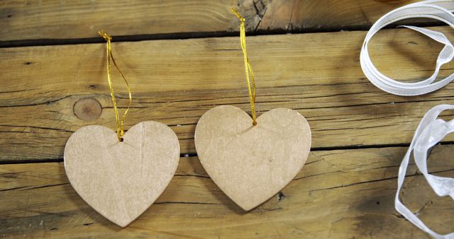 Two Cardboard Heart Ornaments on Rustic Wooden Background - Download Free Stock Images Pikwizard.com