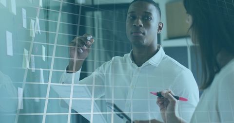 Business Professionals Analyzing Data with Innovative Digital Technology