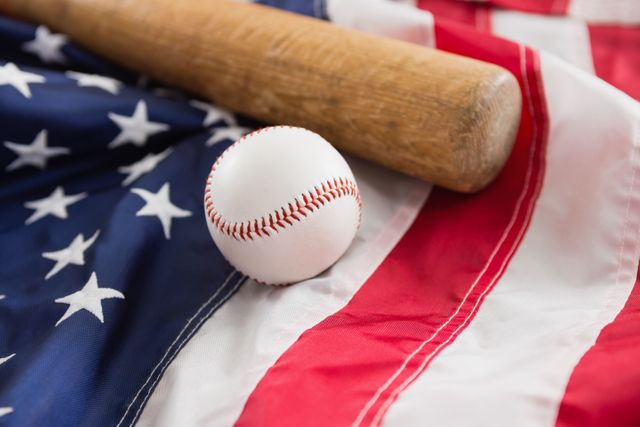 Baseball bat and ball on American flag - Download Free Stock Photos Pikwizard.com