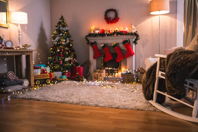 This image depicts a cozy living room decorated for Christmas with a beautifully adorned Christmas tree, presents, and a fireplace with stockings hanging. Ideal for use in holiday greeting cards, festive advertisements, home decor inspiration, and seasonal blog posts.