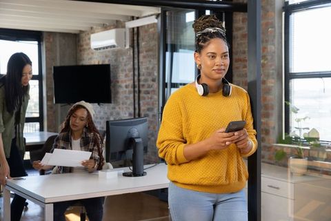 Diverse Female Team Collaborating in Creative Office Environment