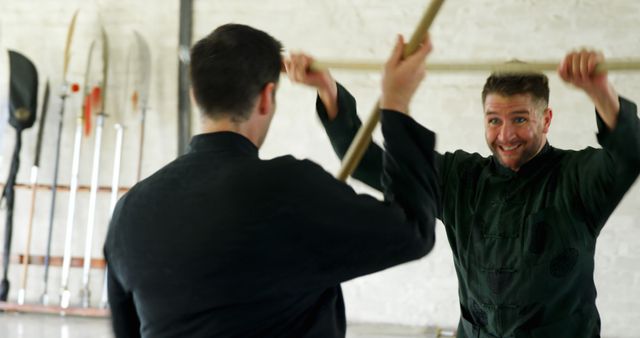 Two Men Practicing Martial Arts with Wooden Weapons - Download Free Stock Images Pikwizard.com