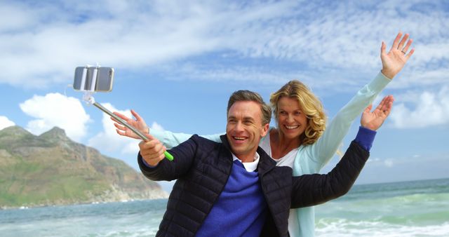 Couple Taking Selfie at the Beach on a Sunny Day - Download Free Stock Images Pikwizard.com