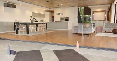 Modern Lifestyle Living Room Connected to Patio with Yoga Mats