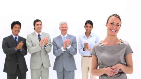 Business Team Applauding Successful Leader in Minimalist Setting