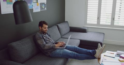 Relaxed Man Working from Home on Laptop with Innovative Ideas - Download Free Stock Images Pikwizard.com