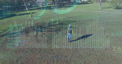 Businessman Walking in Autumn Park with Financial Data Overlay