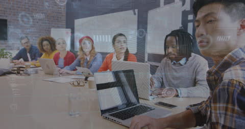 Business Team Discussing Data in Modern Office Environment