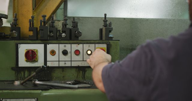 Worker Operating Industrial Machine Control Panel in Factory - Download Free Stock Images Pikwizard.com