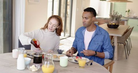 Couple Enjoying Breakfast in Cozy Rustic Kitchen Setting
