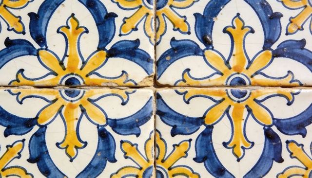 Hand-painted mediterranean ceramic tiles featuring blue-yellow floral quatrefoil pattern