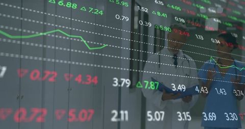 Healthcare Professionals Reviewing Financial Data Overlayed on Hospital Corridor Glass