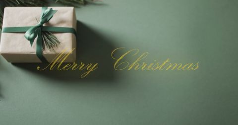 Christmas Gift with Stylish Merry Christmas Text on Green Background - Download Free Stock Images Pikwizard.com