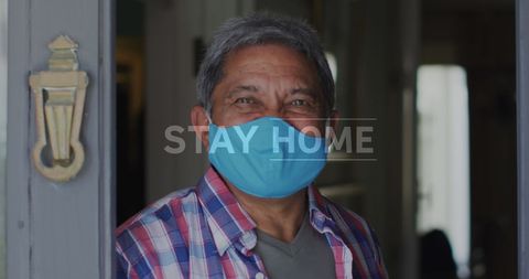 Smiling Senior Man in Mask Practicing Home Isolation for Safety